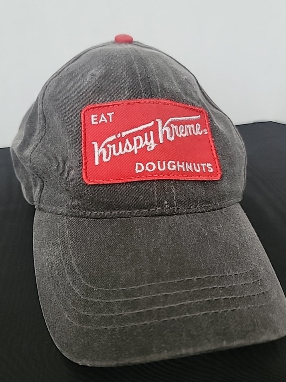 Krispy Kreme Men’s Washed Black Baseball Cap with Red Patch